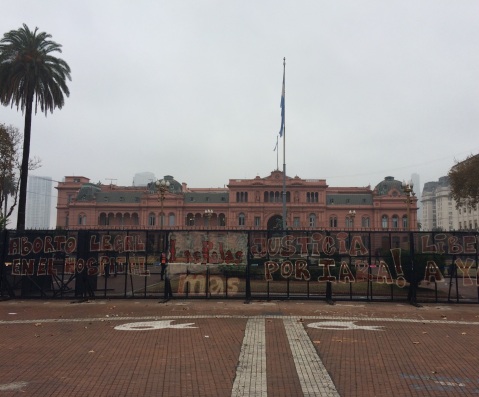 The presidential palace 'Casa Rosada' is currently protected by police fences covered with demands
